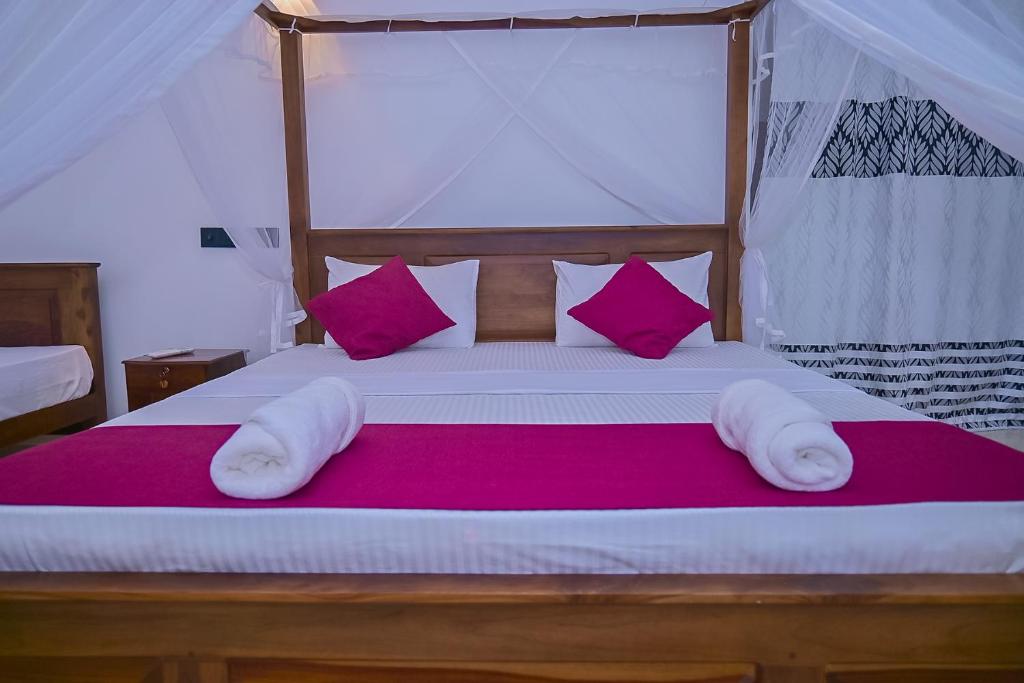 Postel nebo postele na pokoji v ubytování SPRING VILLA AHANGAMA