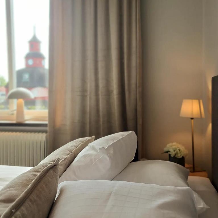 Postel nebo postele na pokoji v ubytování Hotell Rådhuset