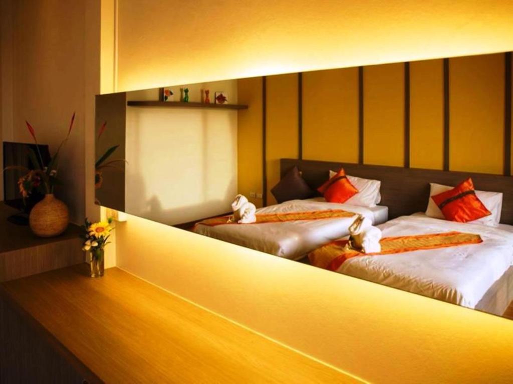 Postel nebo postele na pokoji v ubytování Aurora Resort Khao Yai