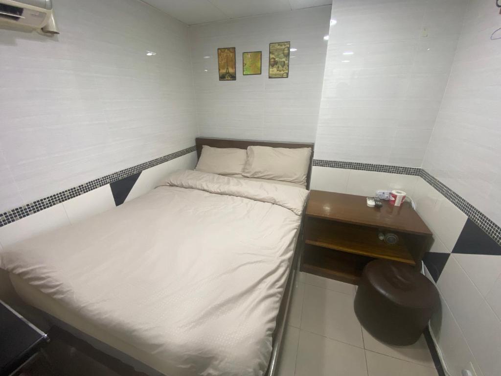 Postel nebo postele na pokoji v ubytování 香港百乐宾馆 Best Guesthouse