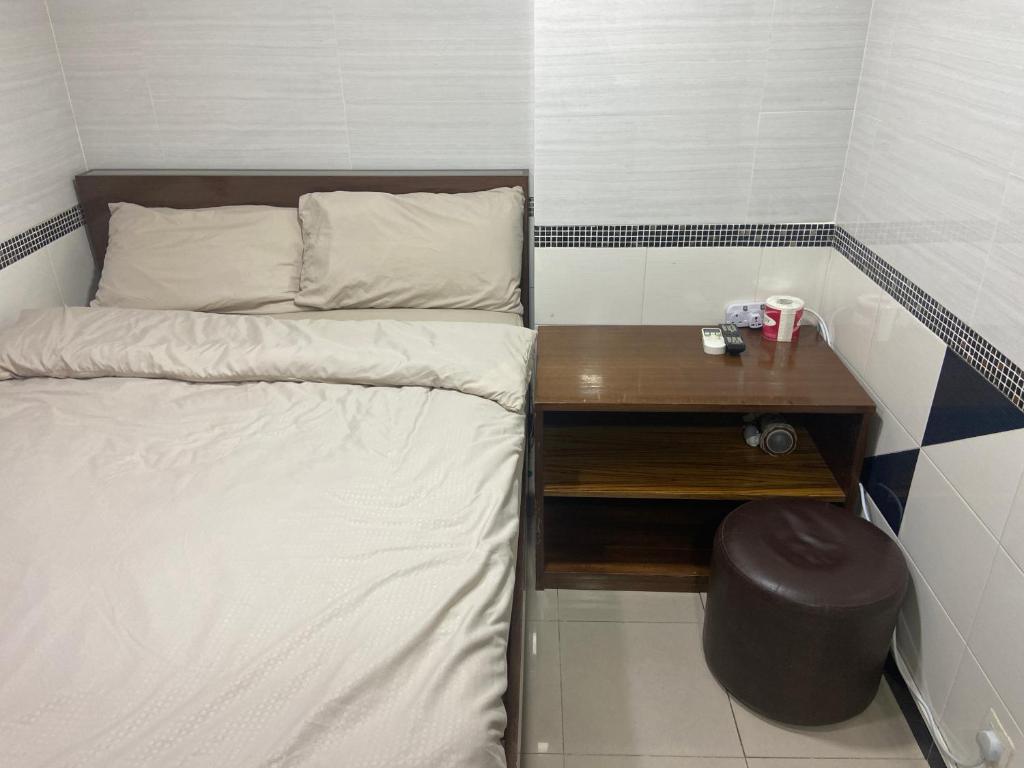 Postel nebo postele na pokoji v ubytování 香港百乐宾馆 Best Guesthouse