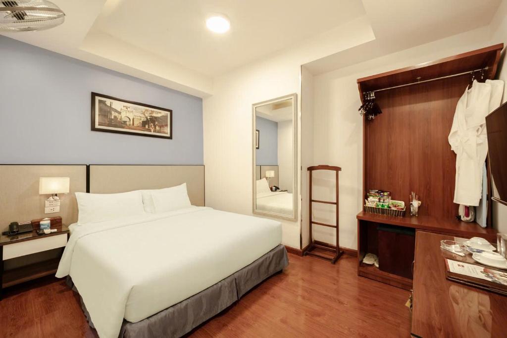 Postel nebo postele na pokoji v ubytování A25 Hotel - 46 Châu Long