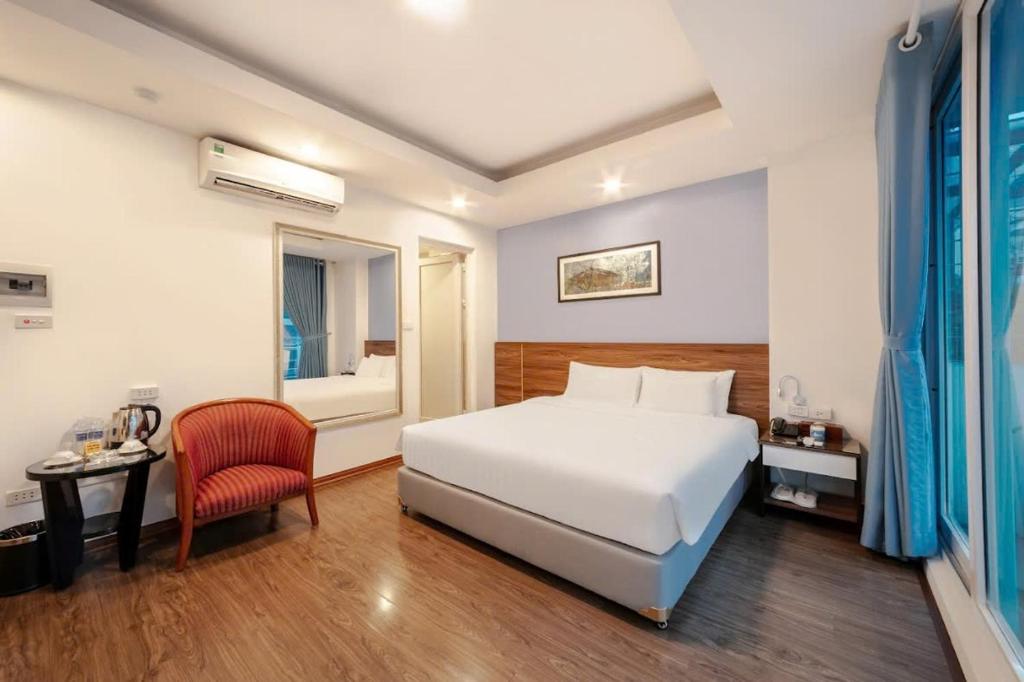 Postel nebo postele na pokoji v ubytování A25 Hotel - 46 Châu Long