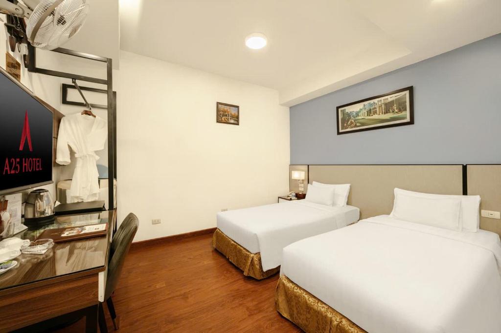 Postel nebo postele na pokoji v ubytování A25 Hotel - 46 Châu Long