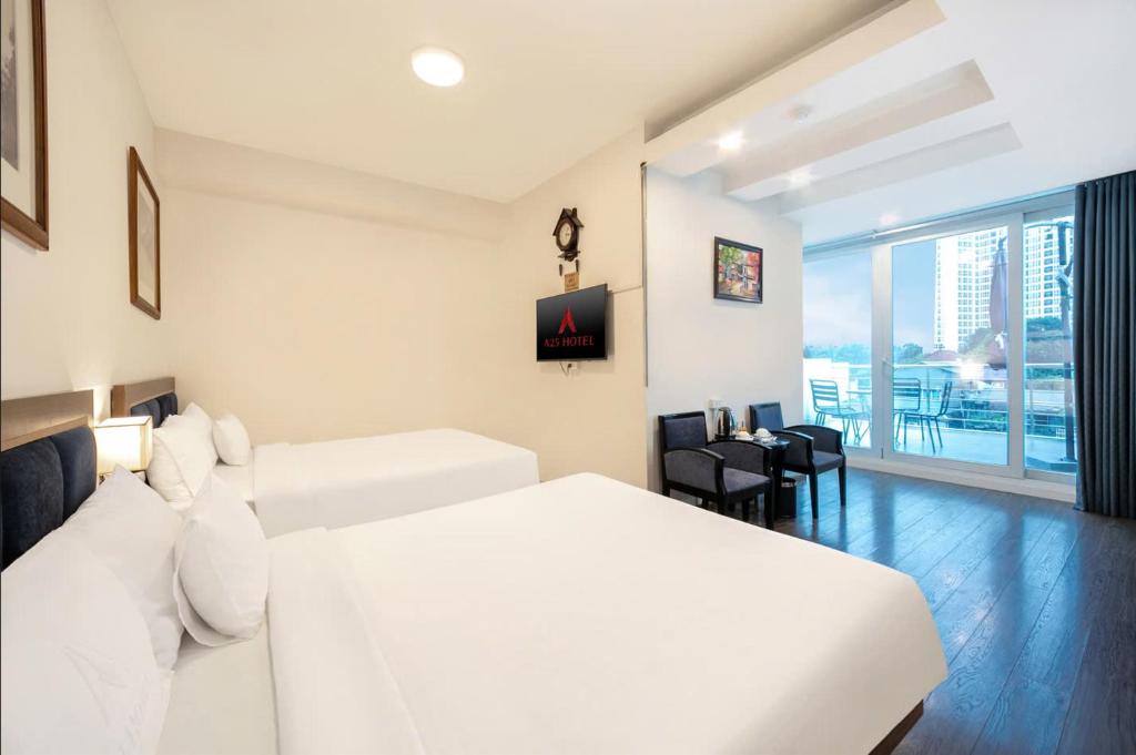 Postel nebo postele na pokoji v ubytování A25 Hotel - 46 Châu Long