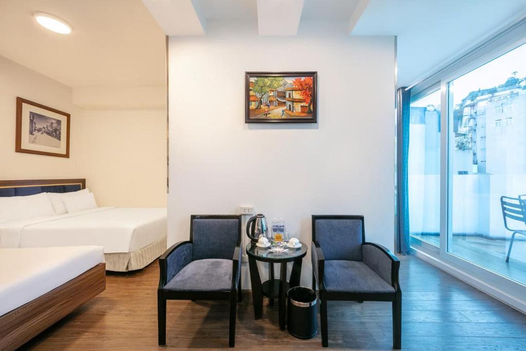 Postel nebo postele na pokoji v ubytování A25 Hotel - 46 Châu Long