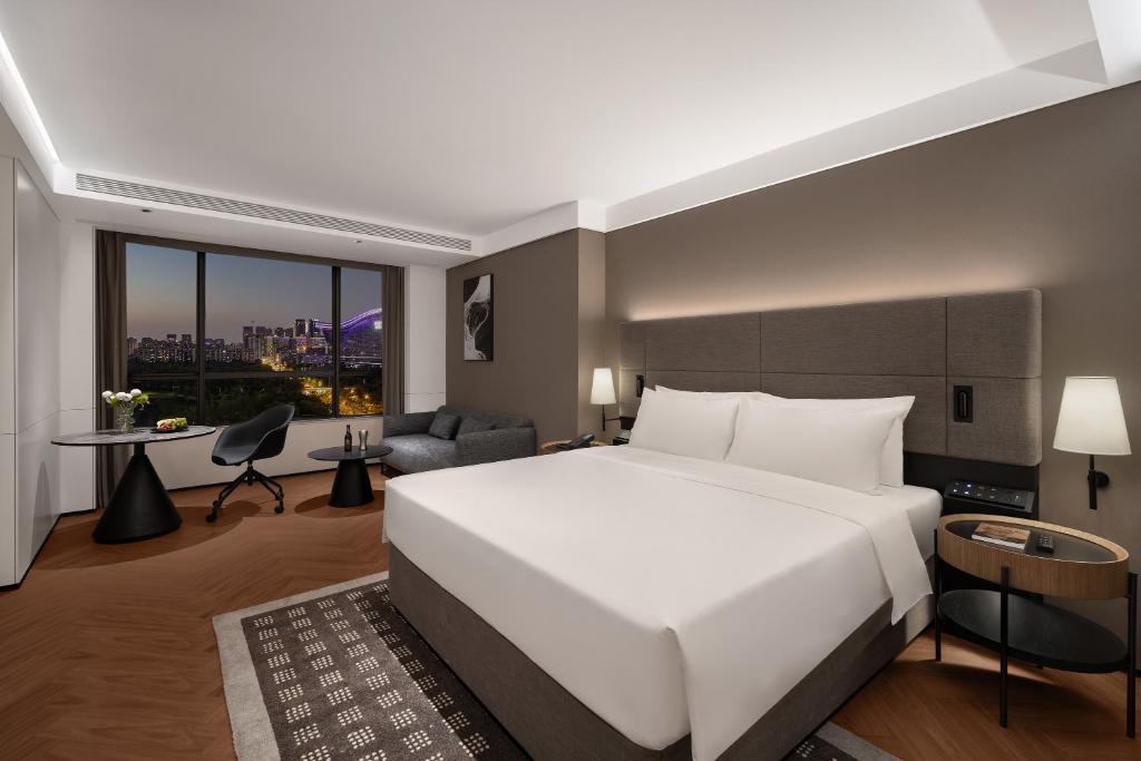Postel nebo postele na pokoji v ubytování Intercity Hotel Chengdu High-tech Global Center