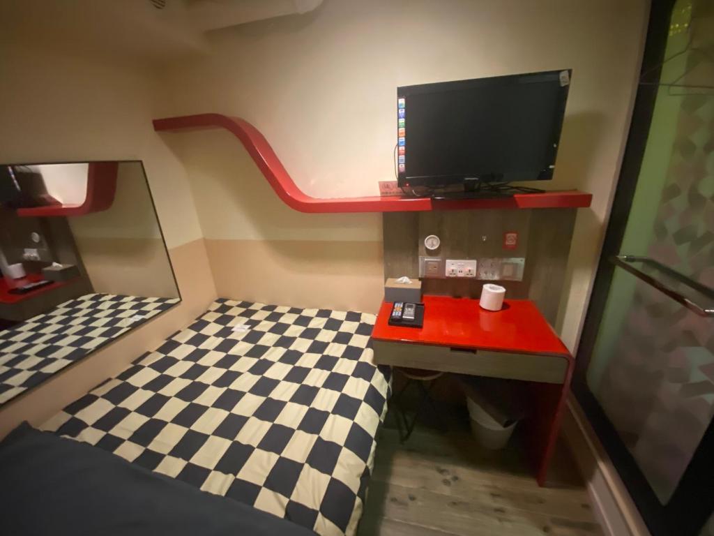 TV a/nebo společenská místnost v ubytování 香港九巴旅馆 KMB-Guesthouse