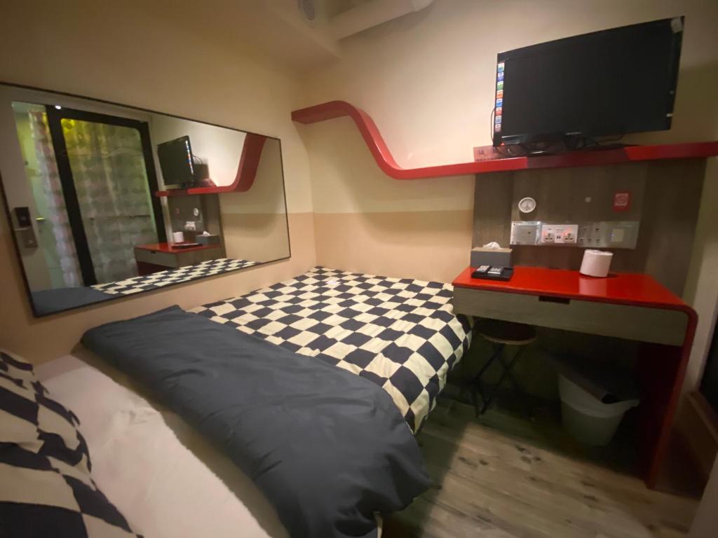 Postel nebo postele na pokoji v ubytování 香港九巴旅馆 KMB-Guesthouse