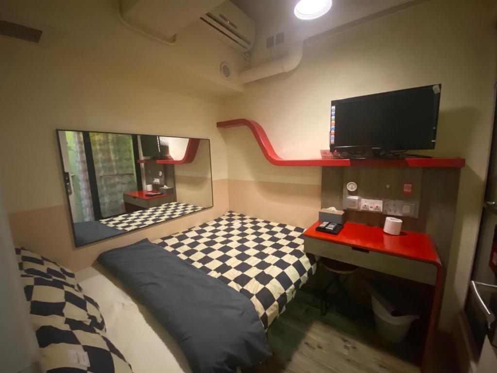 Postel nebo postele na pokoji v ubytování 香港九巴旅馆 KMB-Guesthouse