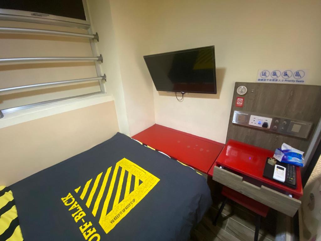 TV a/nebo společenská místnost v ubytování 香港九巴旅馆 KMB-Guesthouse