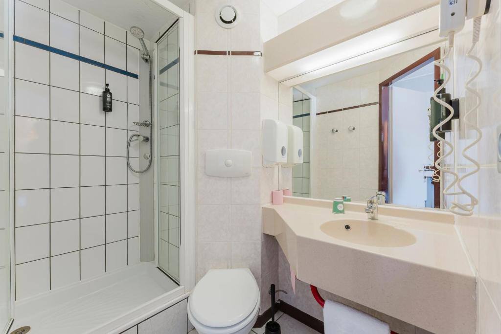 Koupelna v ubytování Cap Hôtel