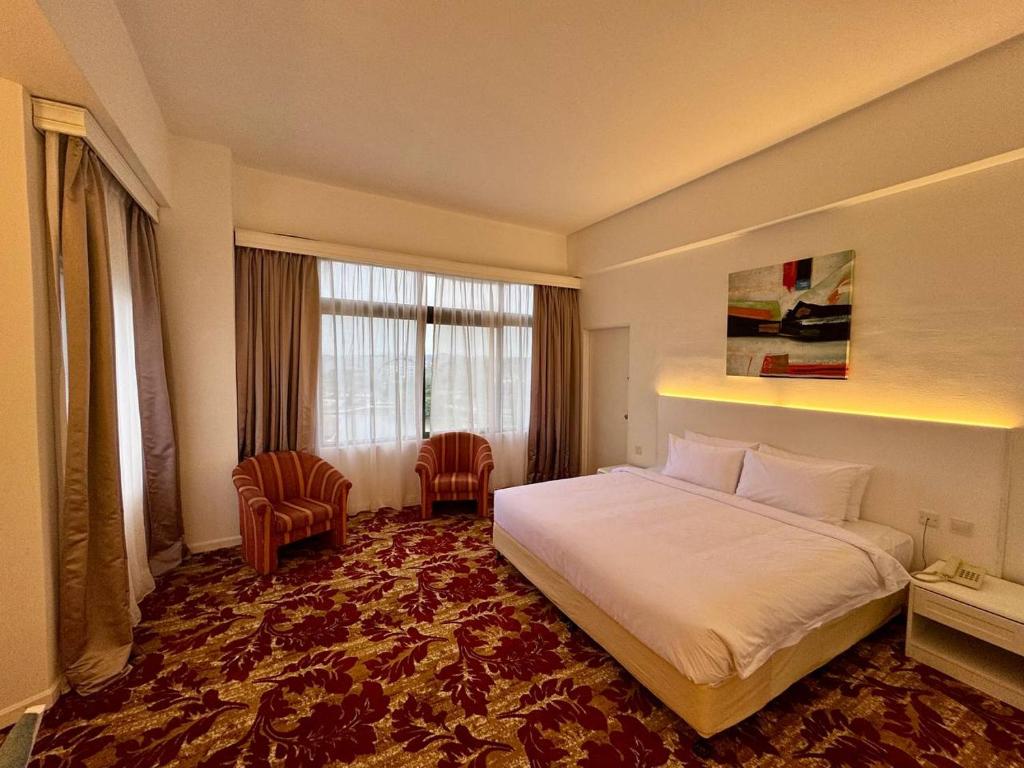 Postel nebo postele na pokoji v ubytování ROYAL PARK HOTEL @ UNITEN