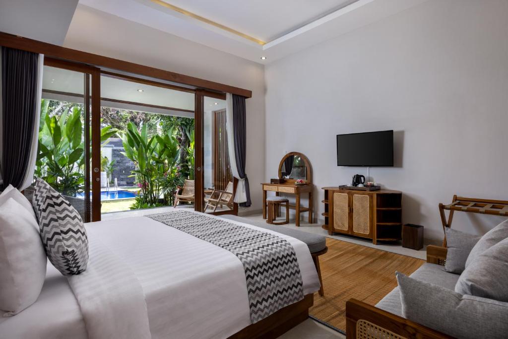 Postel nebo postele na pokoji v ubytování Bhumi Sangtu Ubud