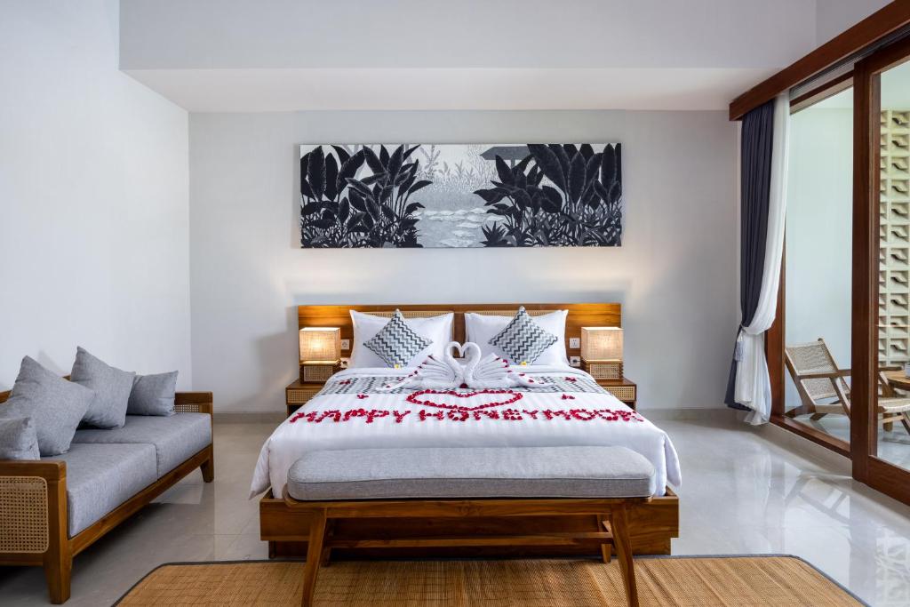 Postel nebo postele na pokoji v ubytování Bhumi Sangtu Ubud
