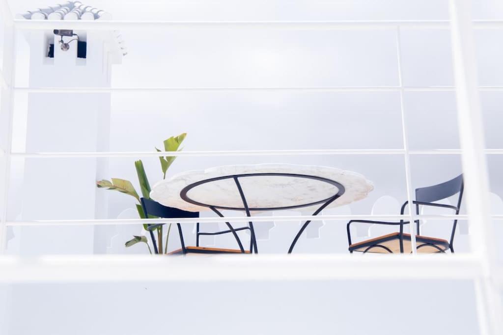 a table and two chairs sitting on a shelf at CASA SIRA-Charming home in the heart of the Kasbah in Tangier