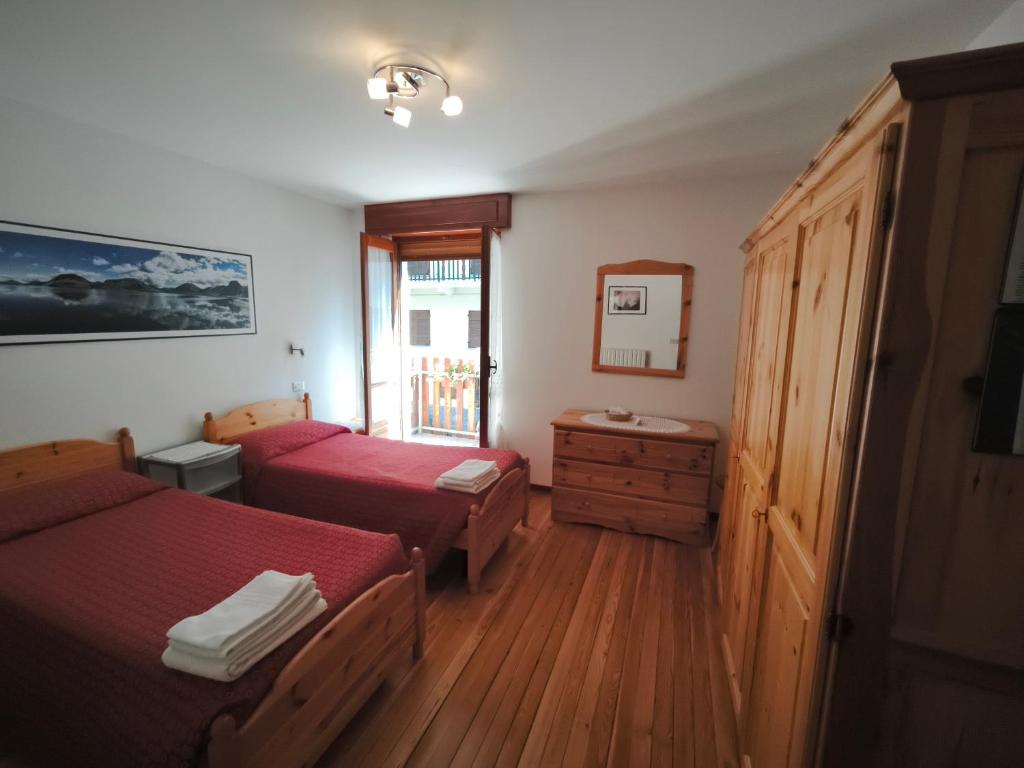 Postel nebo postele na pokoji v ubytování Albergo ristorante Chez Isabel