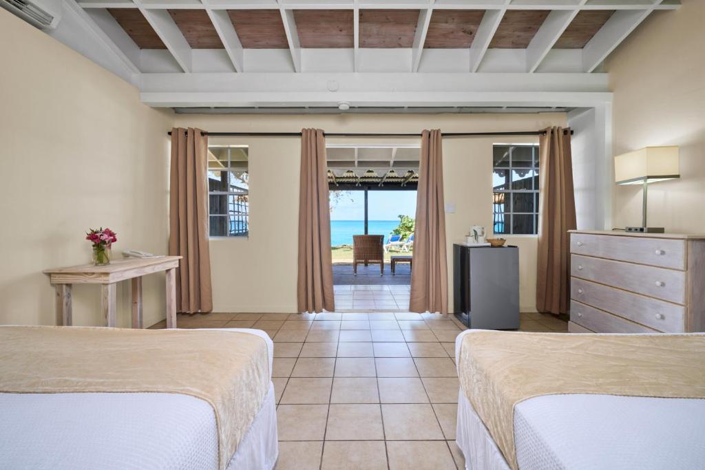Postel nebo postele na pokoji v ubytování Hawksbill Resort Antigua - All Inclusive
