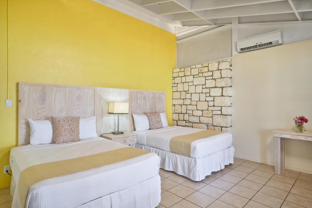 Postel nebo postele na pokoji v ubytování Hawksbill Resort Antigua - All Inclusive