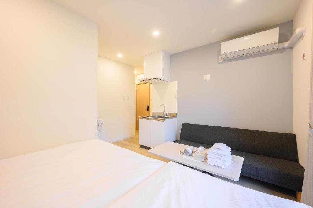 Postel nebo postele na pokoji v ubytování Oku Apartment