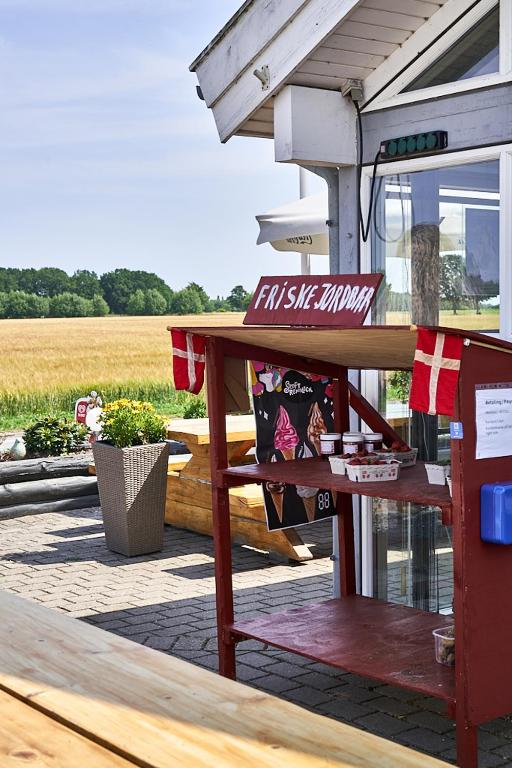 a picnic table with a fast six hungry sign on it at Stevns Camp in Strøby