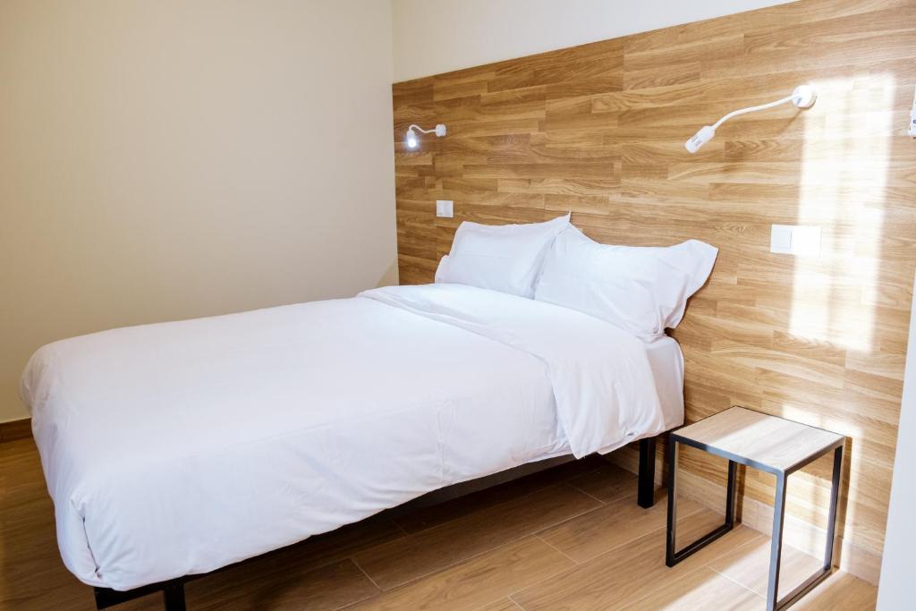 Postel nebo postele na pokoji v ubytování Apartahotel Golden Alcalá