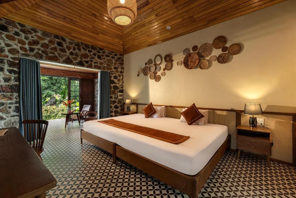 Postel nebo postele na pokoji v ubytování Nature Garden Ecolodge Ninh Bình