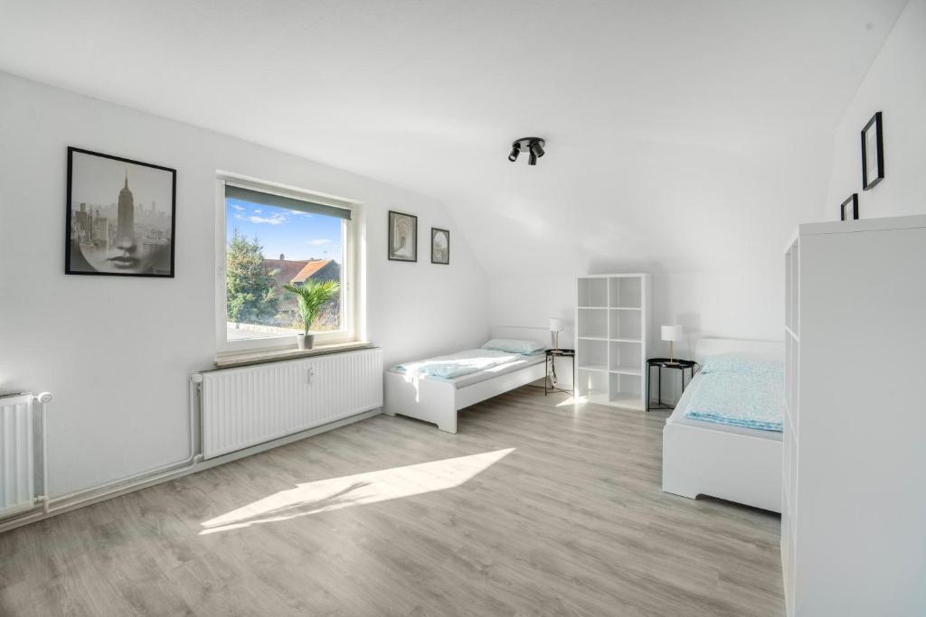 Ένα ή περισσότερα κρεβάτια σε δωμάτιο στο Work & Stay nahe Celle