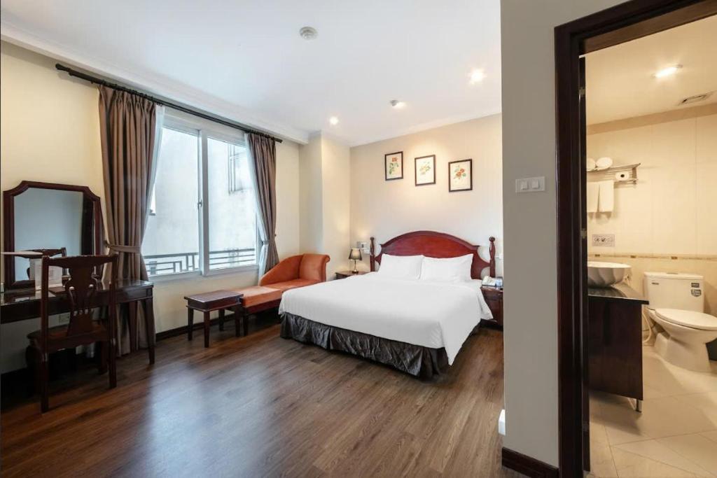 Postel nebo postele na pokoji v ubytování A25 Hotel - 15 Trần Quốc Toản