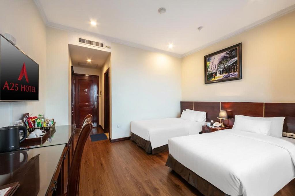 Postel nebo postele na pokoji v ubytování A25 Hotel - 15 Trần Quốc Toản