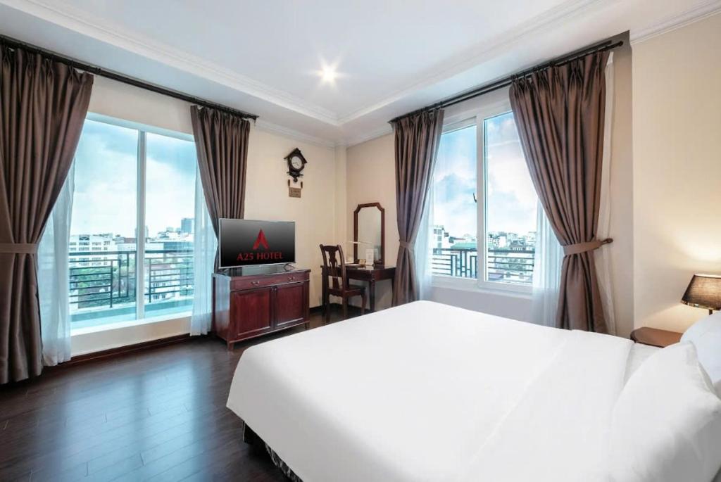 Postel nebo postele na pokoji v ubytování A25 Hotel - 15 Trần Quốc Toản