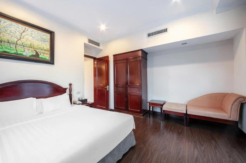 Postel nebo postele na pokoji v ubytování A25 Hotel - 15 Trần Quốc Toản