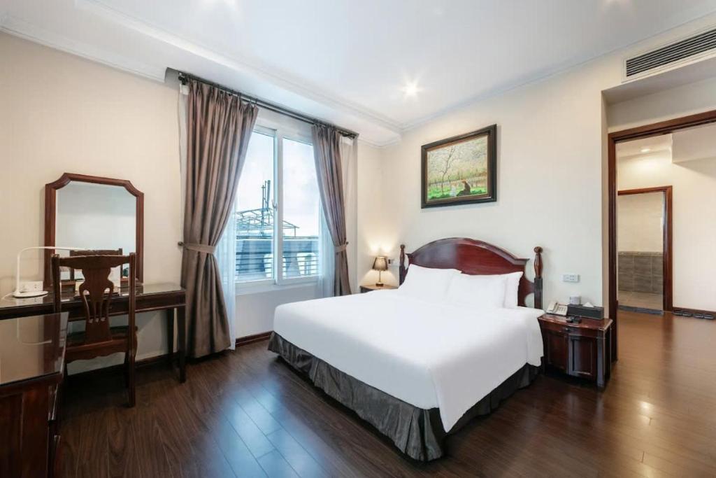 Postel nebo postele na pokoji v ubytování A25 Hotel - 15 Trần Quốc Toản