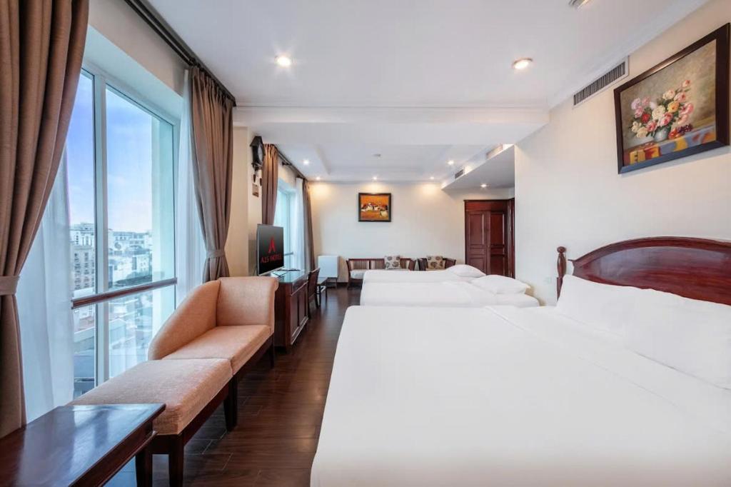 Postel nebo postele na pokoji v ubytování A25 Hotel - 15 Trần Quốc Toản