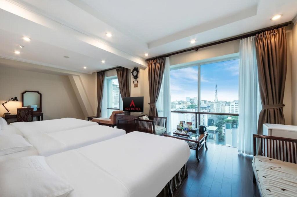 Postel nebo postele na pokoji v ubytování A25 Hotel - 15 Trần Quốc Toản