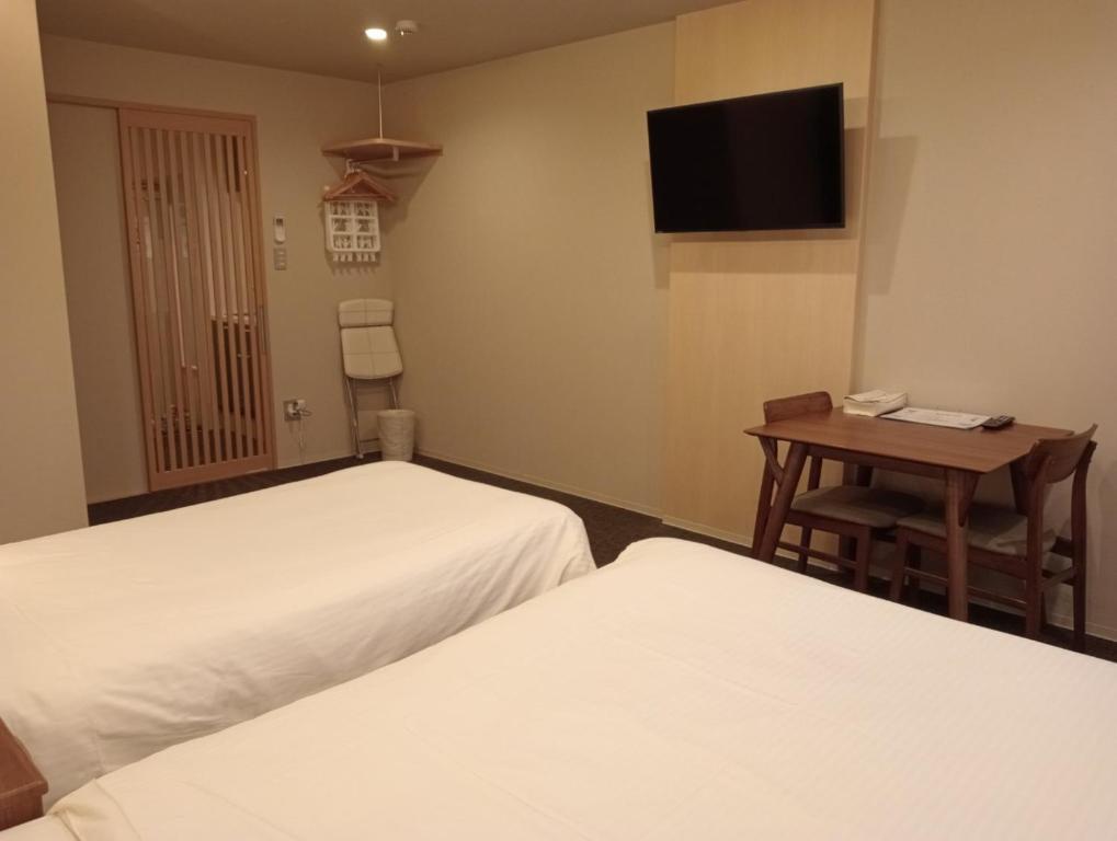 Postel nebo postele na pokoji v ubytování HIZ HOTEL Gion-Shirakawa