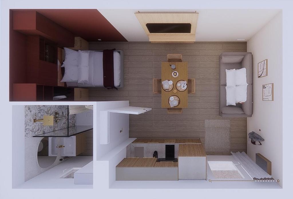 ein Modell eines Zimmers mit Bett und Uhren in der Unterkunft Limiria Studio in Santa-Maria-Poggio