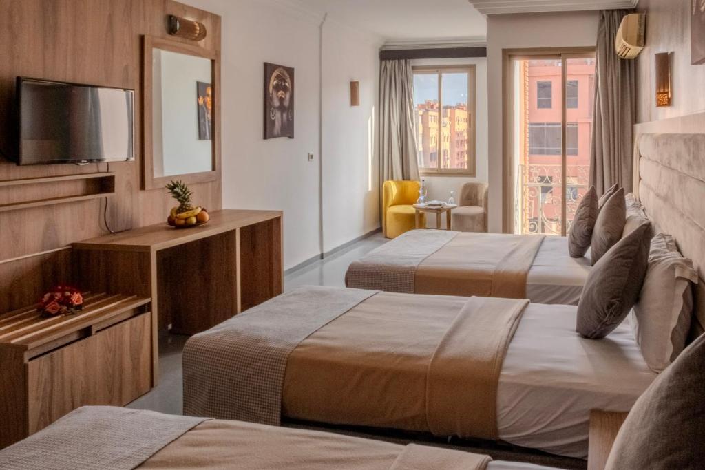 Postel nebo postele na pokoji v ubytování Imperial Holiday Hôtel & spa