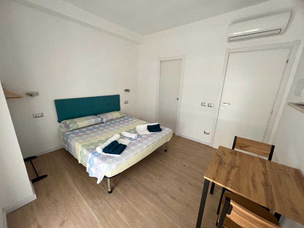 Postel nebo postele na pokoji v ubytování Lighthouse Affittacamere Alghero