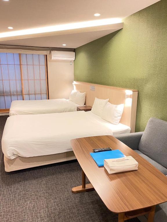 Postel nebo postele na pokoji v ubytování HIZ HOTEL Gion-Shirakawa