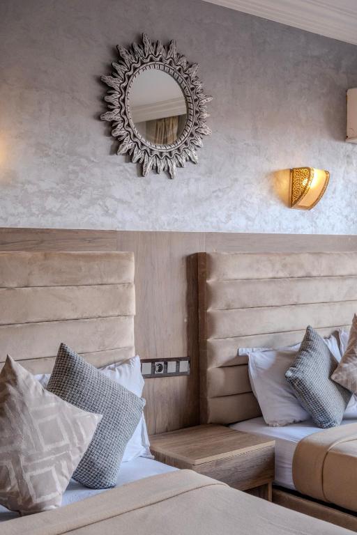 Postel nebo postele na pokoji v ubytování Imperial Holiday Hôtel & spa