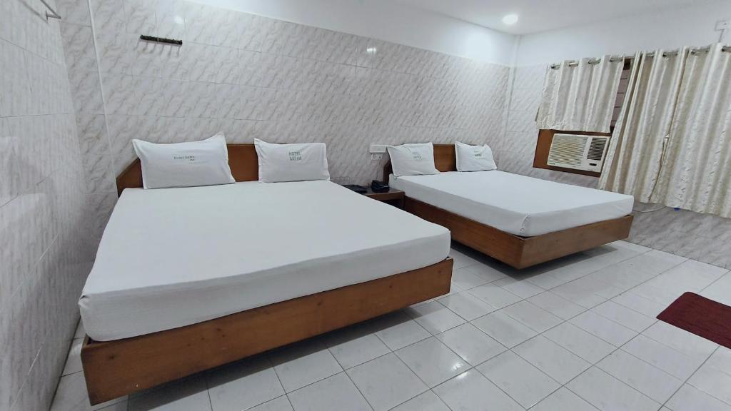 Postel nebo postele na pokoji v ubytování Hotel Safra