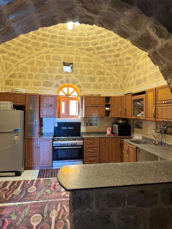 Kuchyň nebo kuchyňský kout v ubytování Pidgeon Lodge - Tunis Village