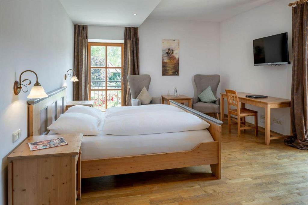 Postel nebo postele na pokoji v ubytování Landgasthof Kammbräu