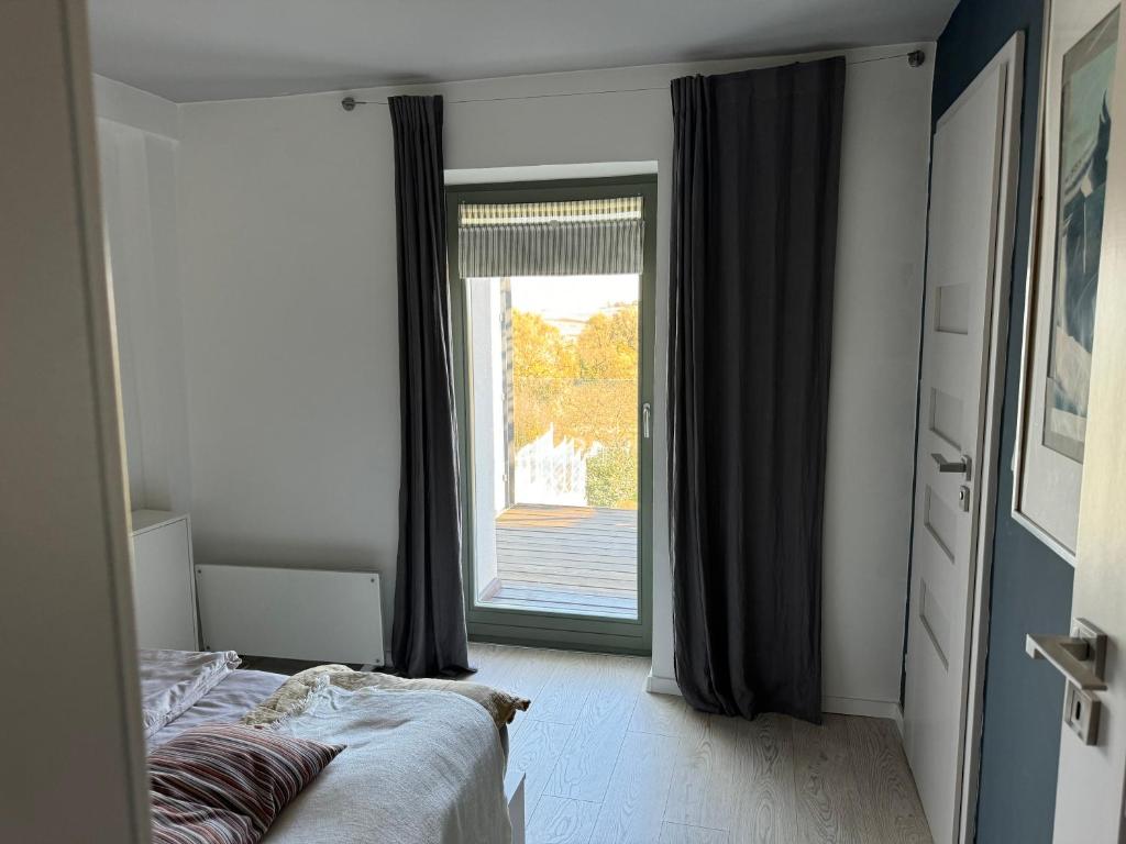 A bed or beds in a room at ZiMo Taliándörögdi MoZiHáz
