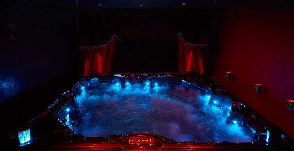 a car in a dark room with blue lights at Apartment Cuba Zen Actitud in Mouscron