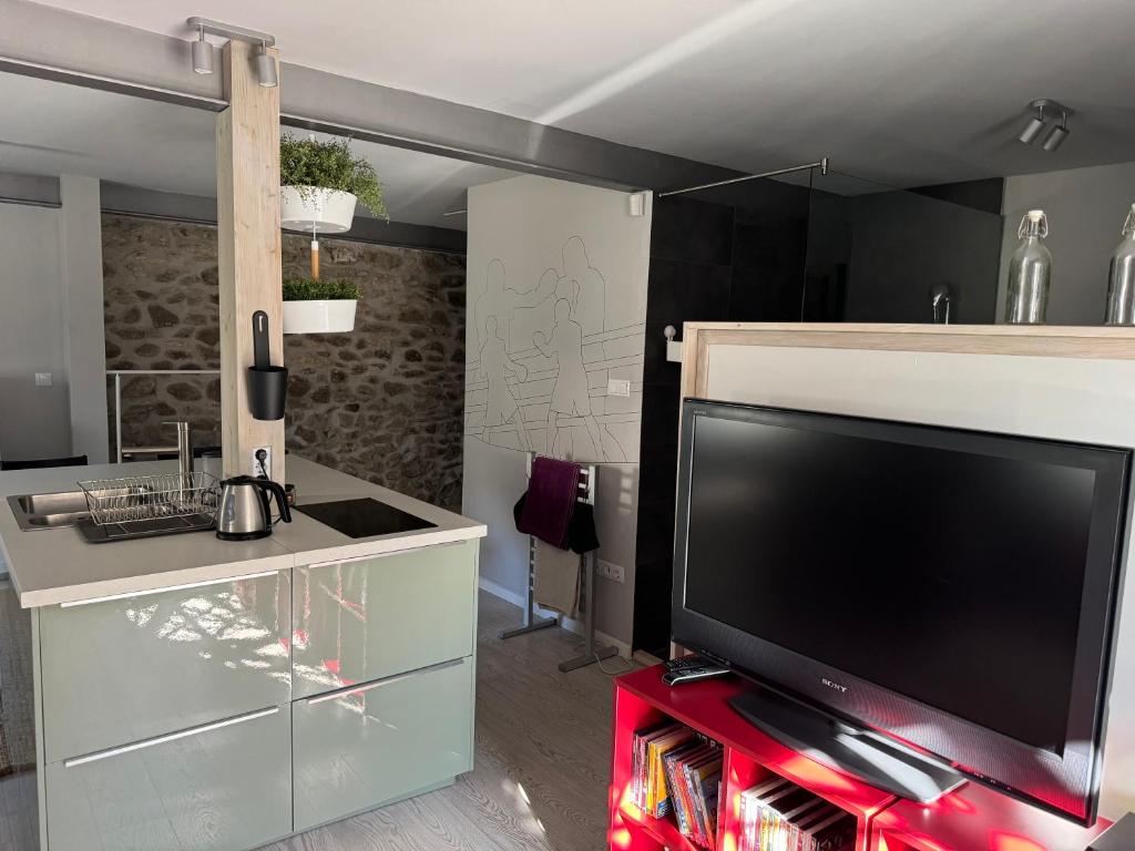 A kitchen or kitchenette at ZiMo Taliándörögdi MoZiHáz