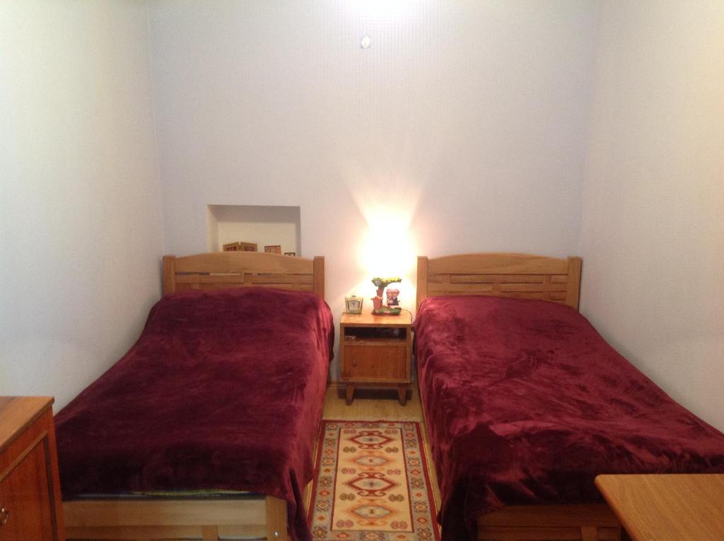 Postel nebo postele na pokoji v ubytování Guest House Nana in Mestia
