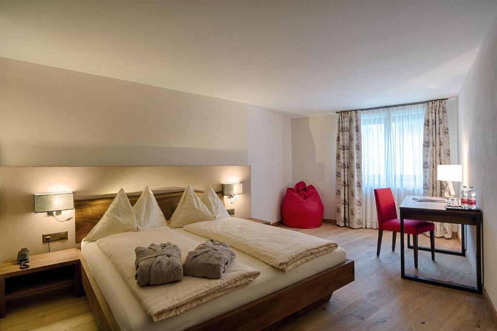 Postel nebo postele na pokoji v ubytování Hotel Cervo