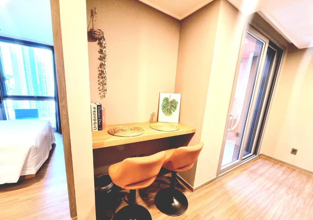 Postel nebo postele na pokoji v ubytování Raviens라비앙즈